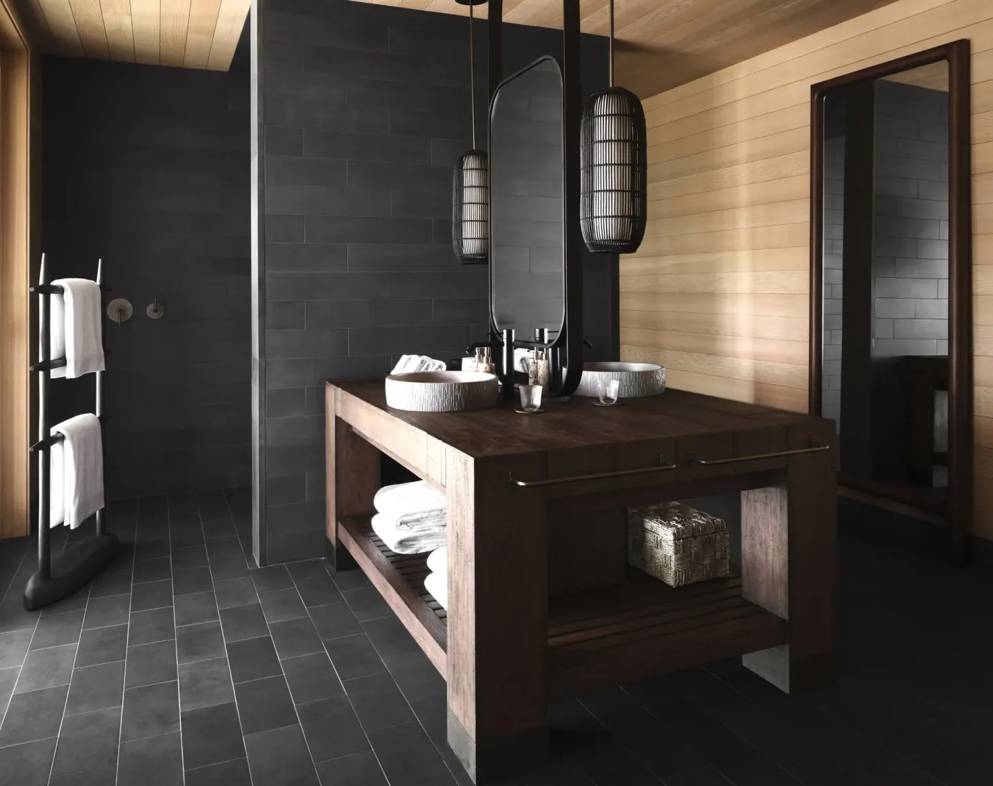 Bathroom vanity and open shower in the Ocean Front Four Bedroom Maheawalu Kauhale at Kona Village.