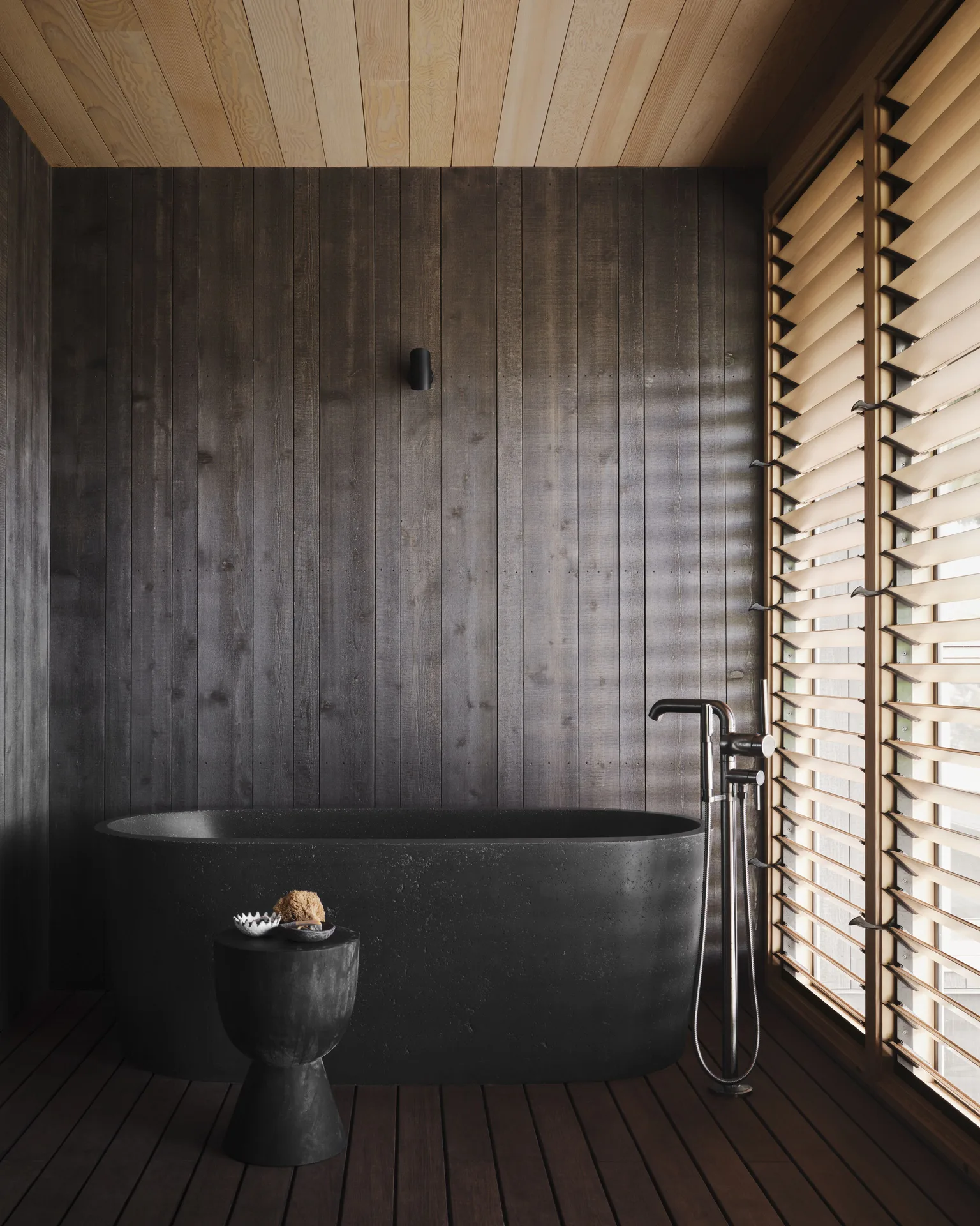 Beach Room Front Hale at Kona Village with traditional Hawaiian design, freestanding bathtub, and direct black sand beachfront access on the Big Island.