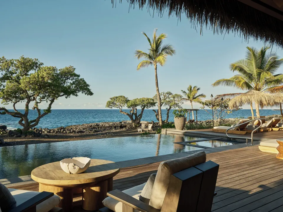 Oceanfront pool deck at Ocean Front Four Bedroom Maheawalu Kauhale at Kona Village.