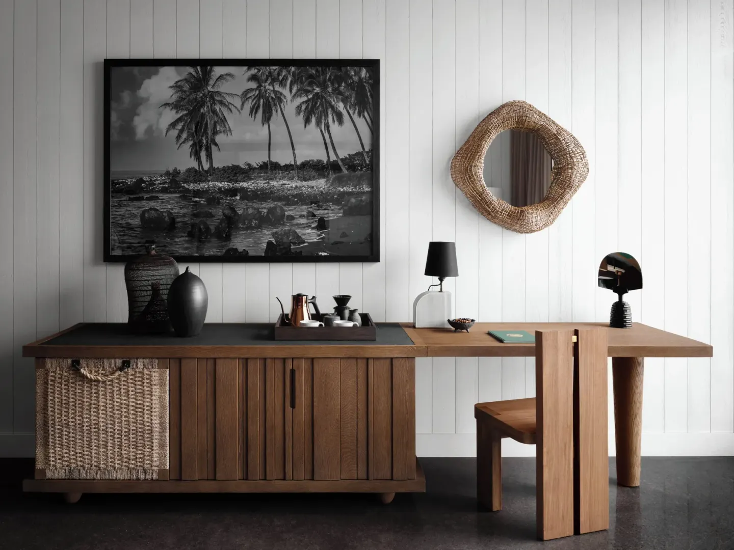 Desk, cabinet, framed palm art, and mirror in a Kona Village guest room.