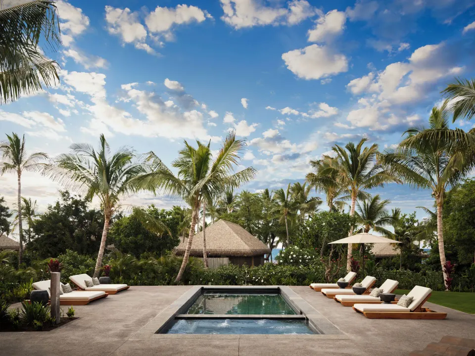 Private pool and loungers at the Ohana Pool Accessible Four Bedroom Kauhale at Kona Village.