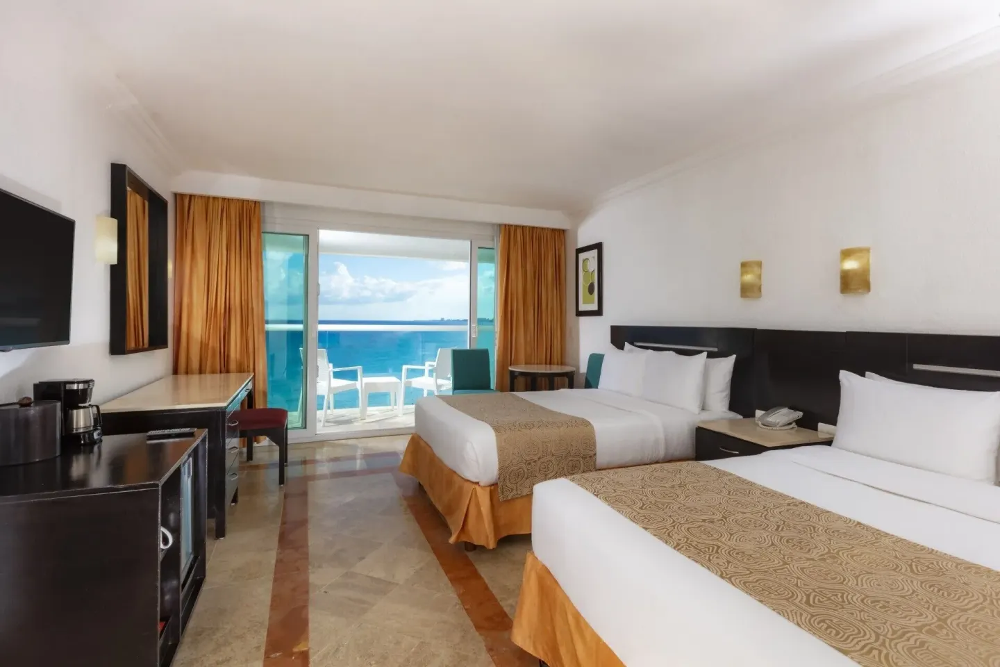 Deluxe ocean view room with two beds and balcony at Krystal Cancun.