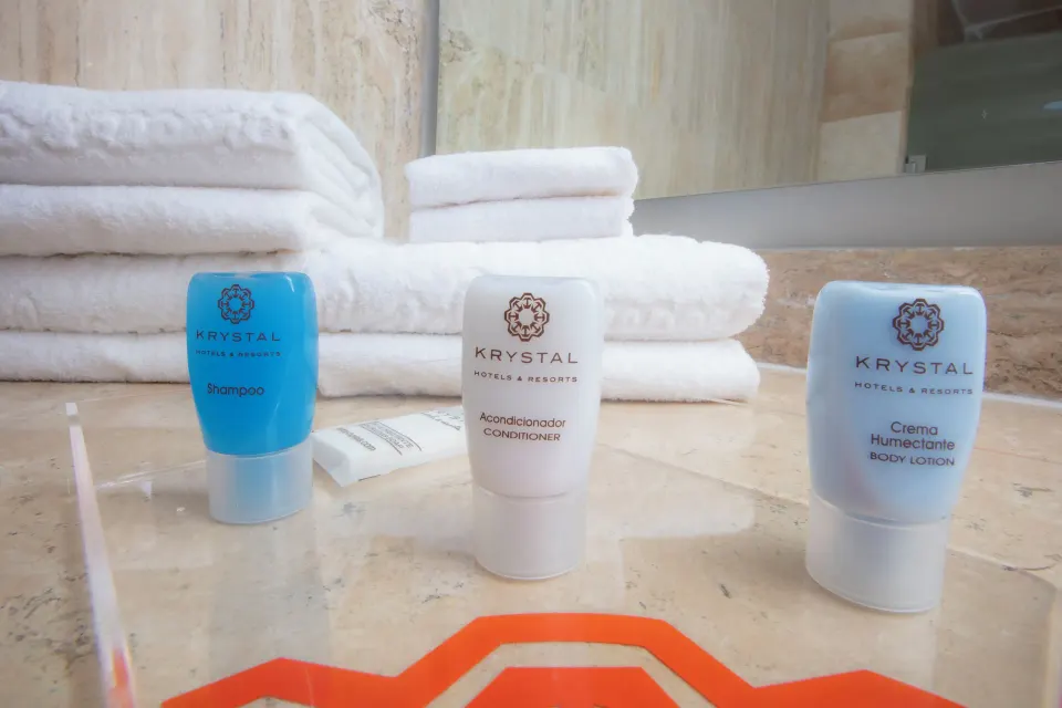 Standard Room City View bath amenities and folded towels at Krystal Cancun.