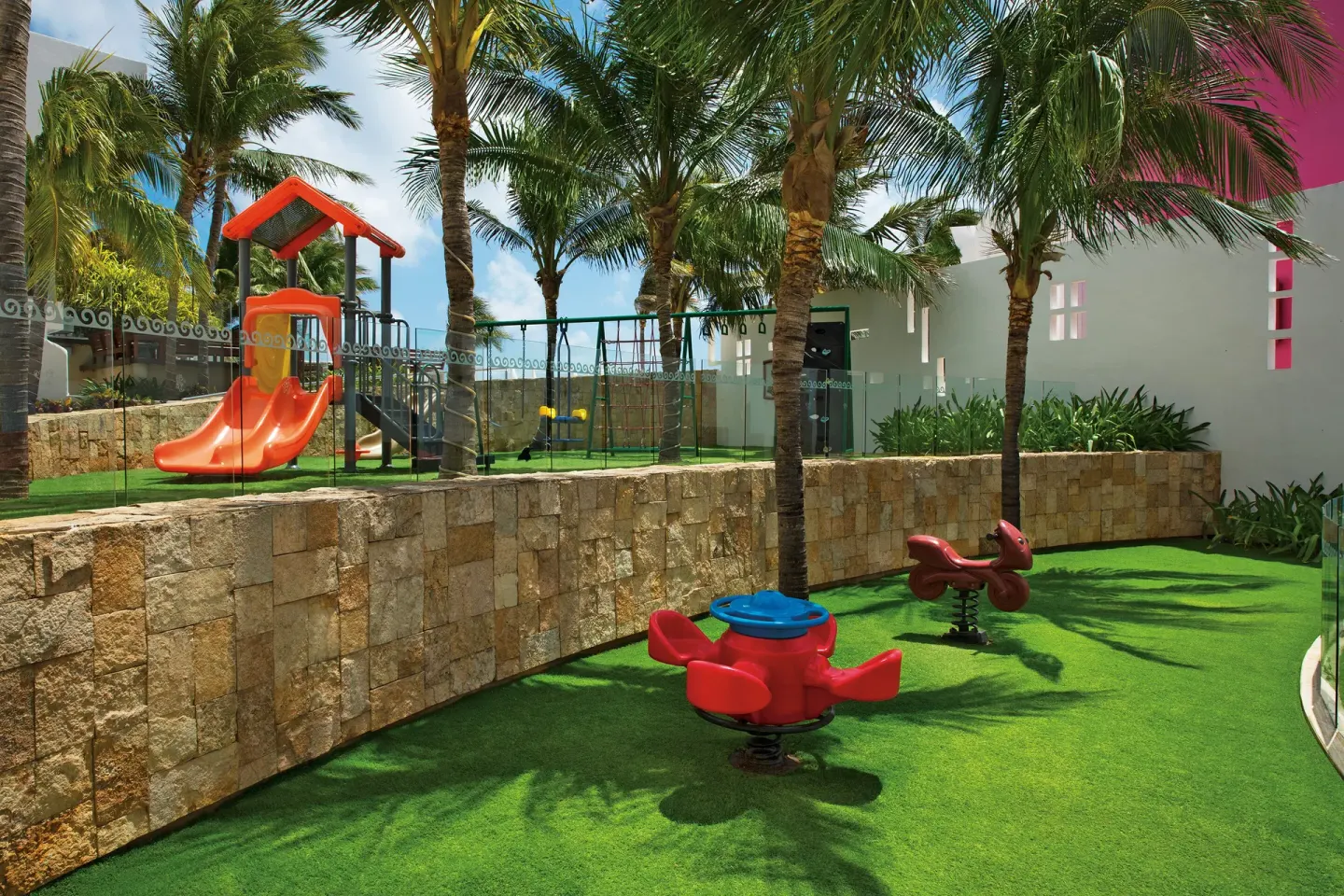 Children’s playground with slides and spring riders at Krystal Grand Cancun.