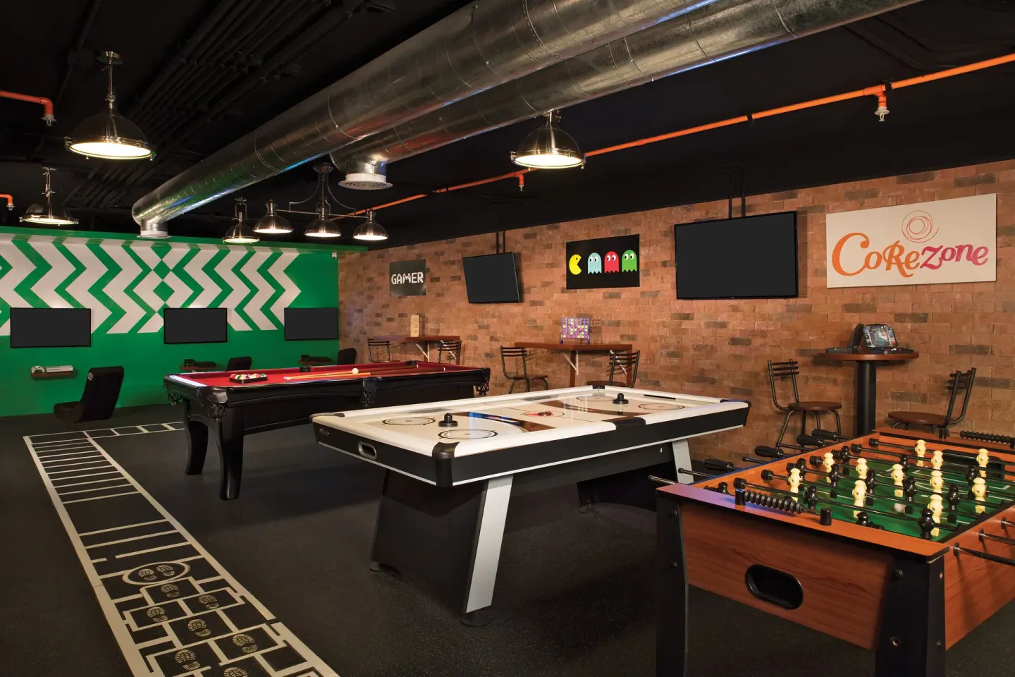 Game room with foosball, air hockey and billiards at Krystal Grand Cancun.