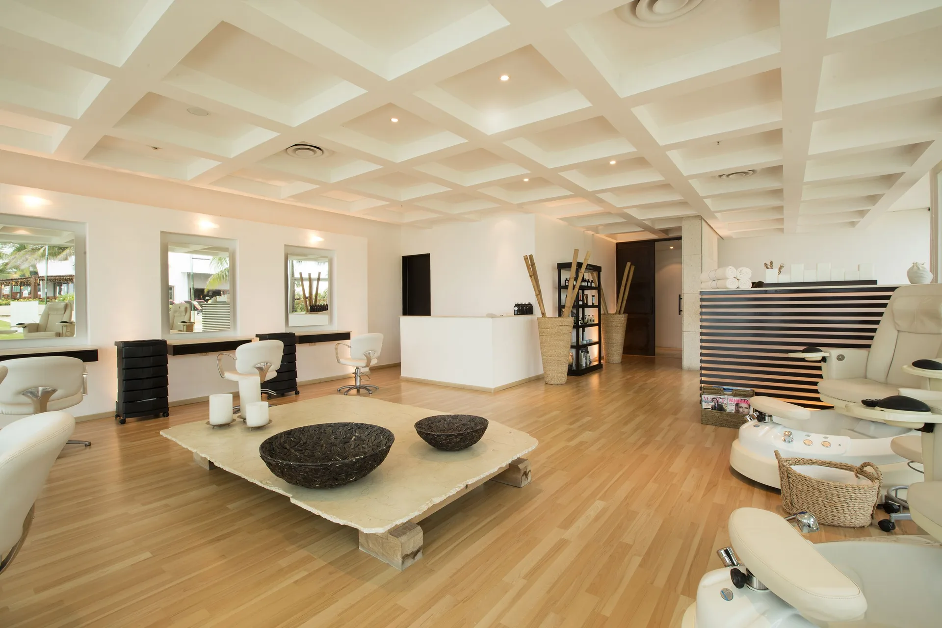 Spa salon area with styling stations and pedicure chairs at Krystal Grand Cancun.