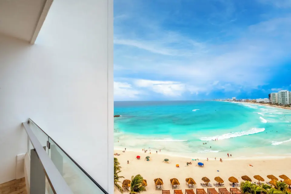 Deluxe Room Ocean View balcony overlooking the beach at Krystal Grand Cancun.