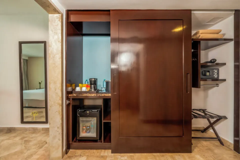 Deluxe Room Ocean View storage and minibar area at Krystal Grand Cancun.