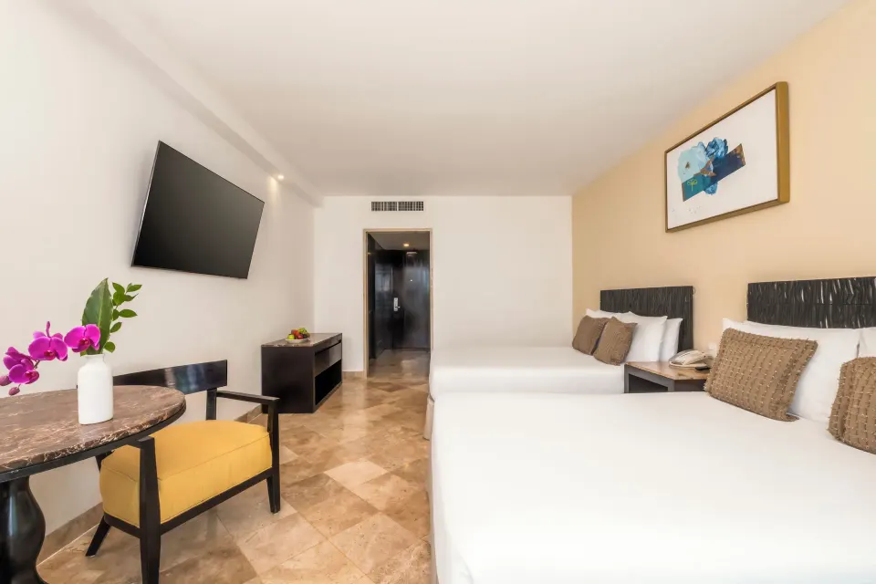 Deluxe Room Ocean View two double beds with entry view at Krystal Grand Cancun.