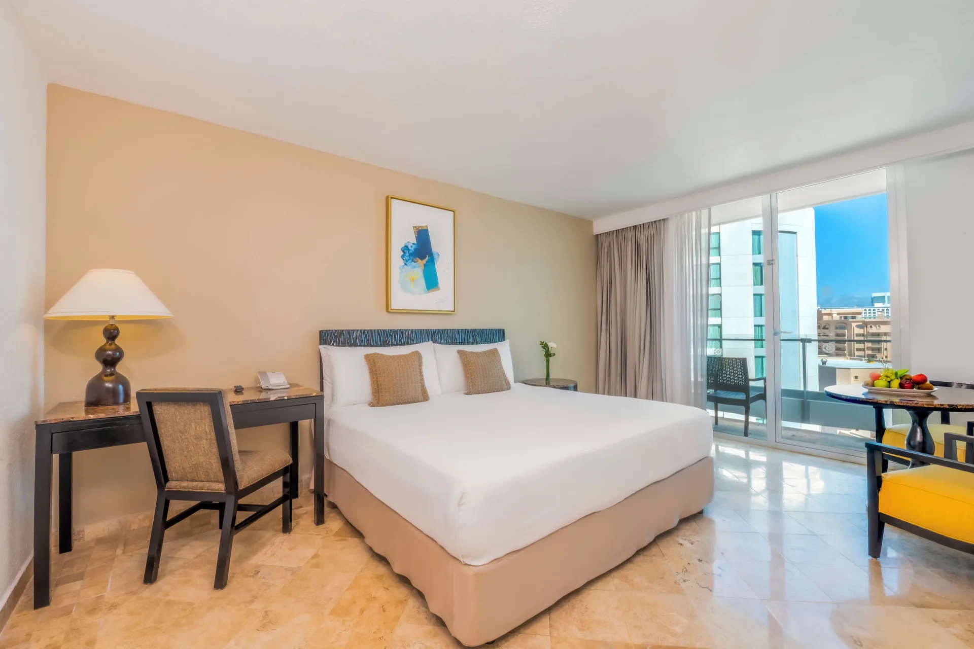 Altitude Room Ocean View Panoramic at Krystal Grand Cancun with king bed, balcony, and panoramic ocean view in Cancun's Hotel Zone.
