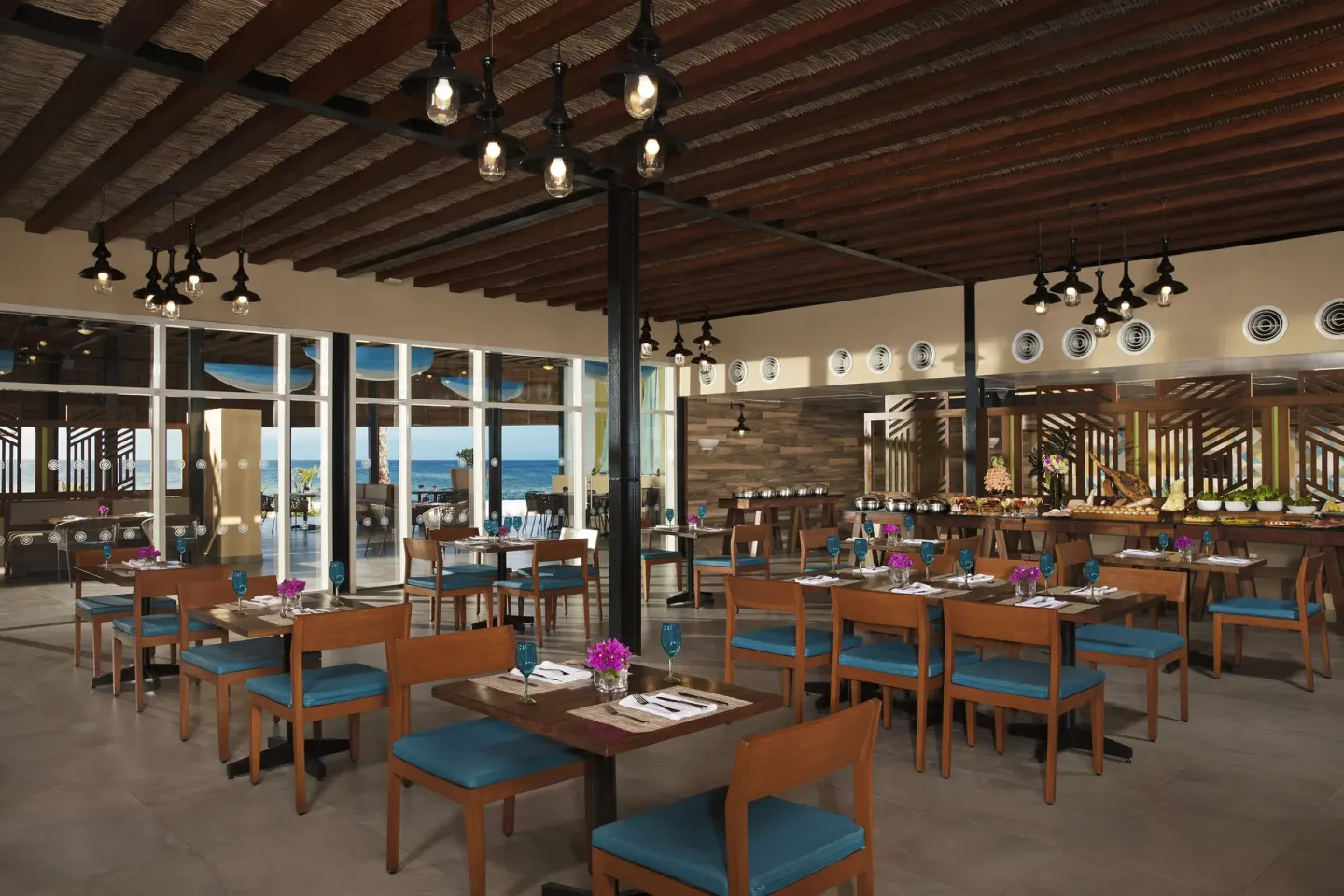 Buffet restaurant seating with ocean views at Krystal Grand Los Cabos.