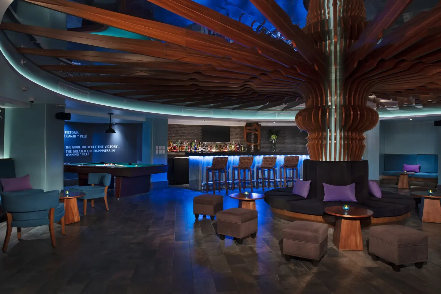 Sports bar with pool table and blue-lit counter at Krystal Grand Los Cabos.