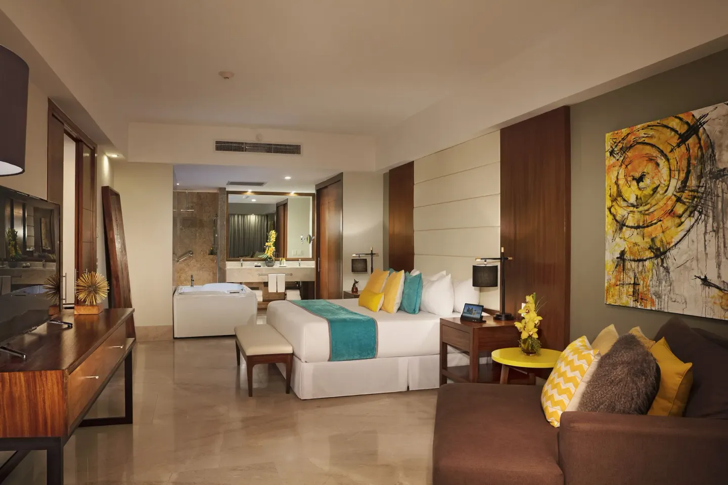 Altitude Presidential Suite king bed and bath area at Krystal Grand Los Cabos.