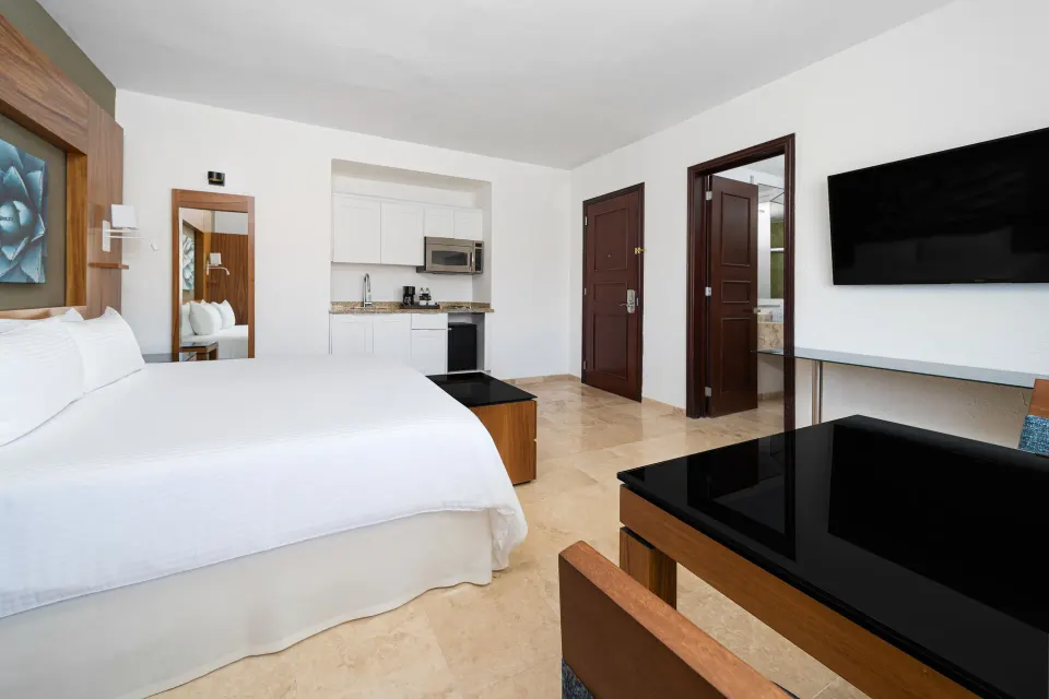 Deluxe Palmilla Garden View king room with kitchenette at Krystal Grand Los Cabos.
