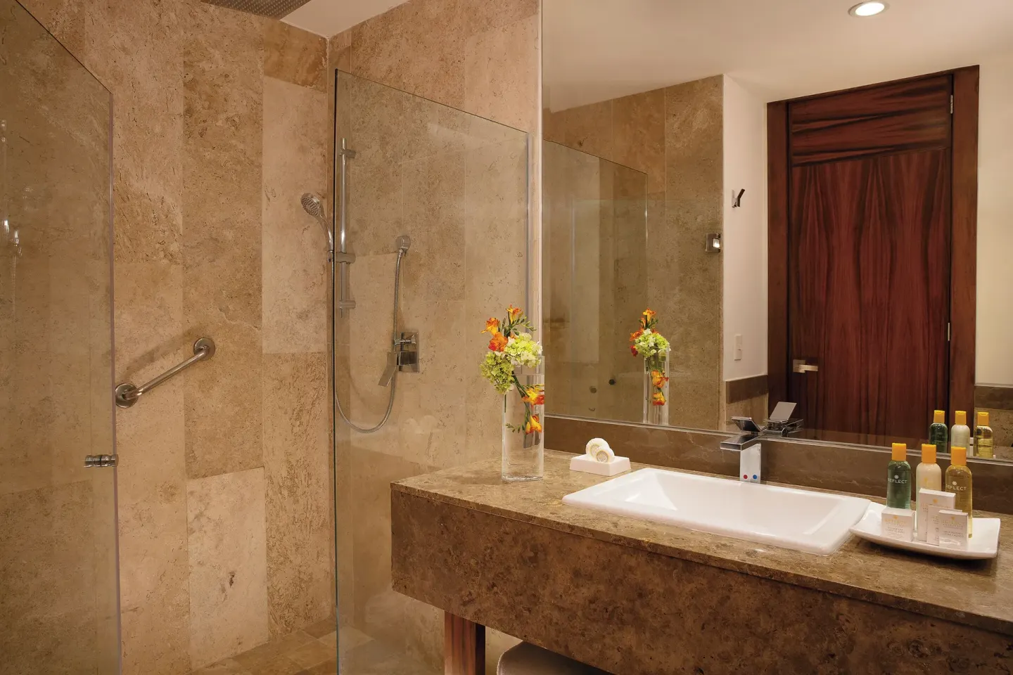 Junior Suite Ocean View bathroom with shower and sink at Krystal Grand Los Cabos.