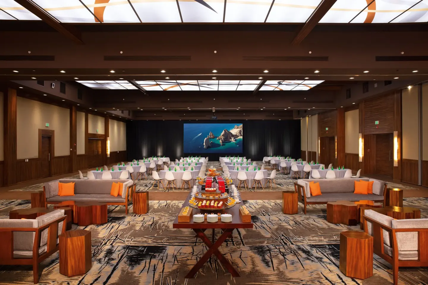 Conference ballroom with theater seating and refreshment table at Krystal Grand Los Cabos.
