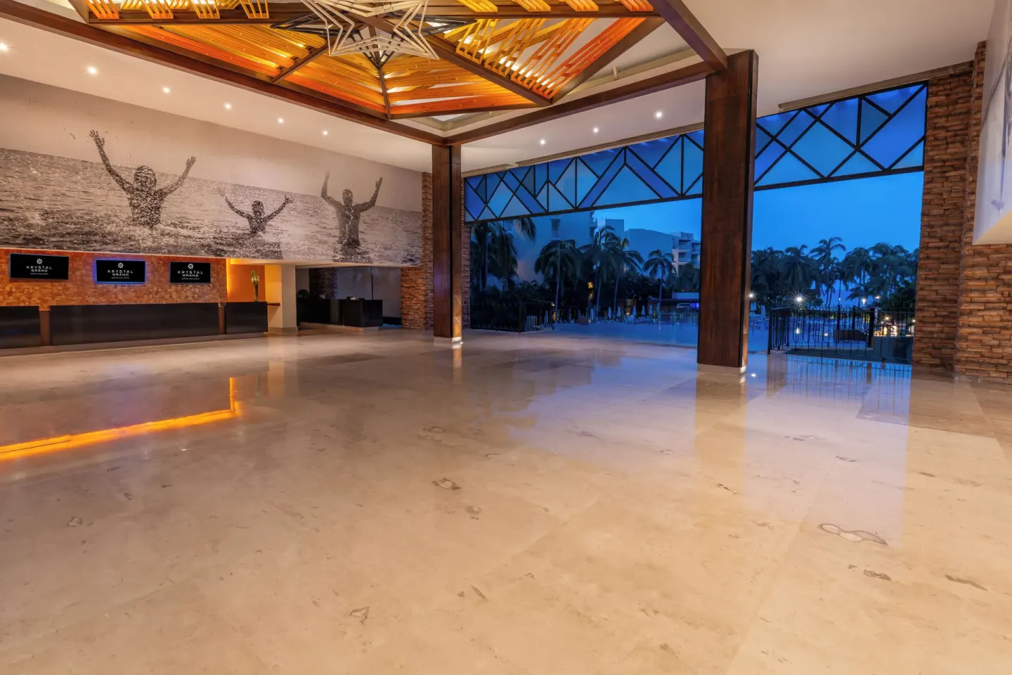 Open-air lobby with reception desks at Krystal Grand Nuevo Vallarta.