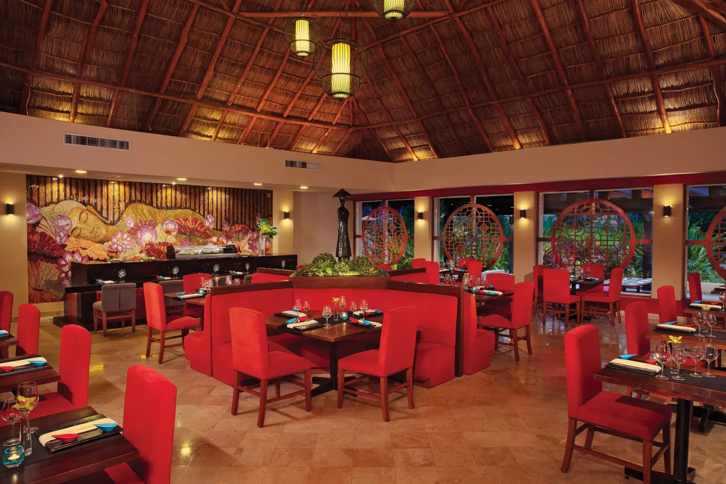 Asian-style dining room with red seating at Krystal Grand Nuevo Vallarta.