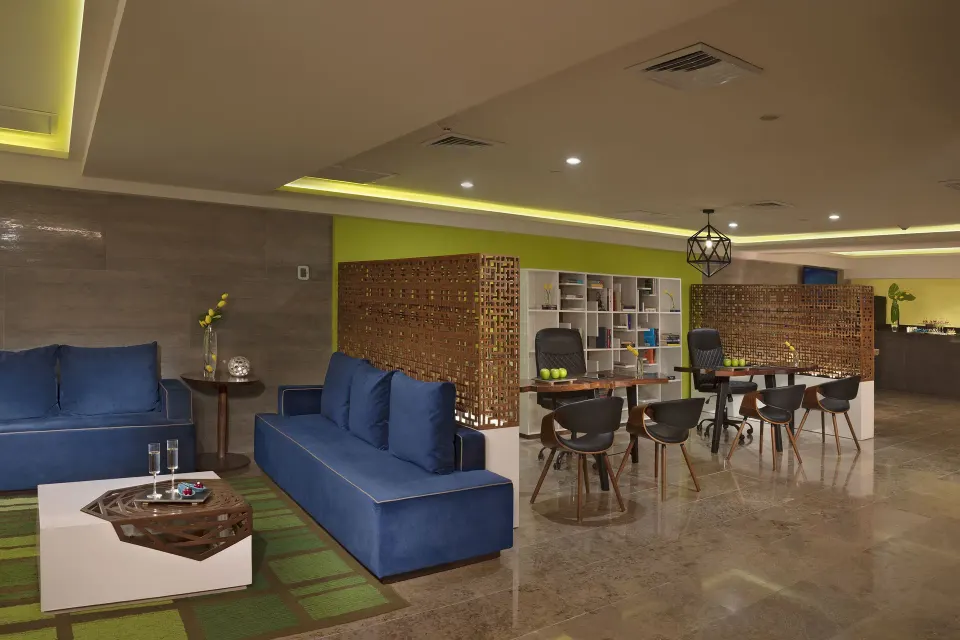 Altitude Club lounge seating and work tables at Krystal Grand Nuevo Vallarta.