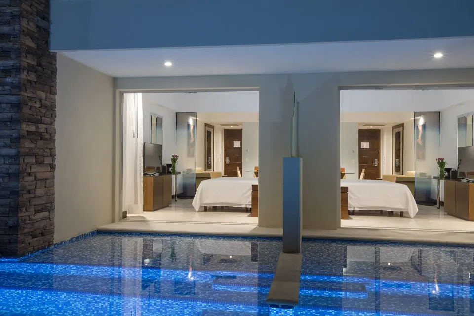 Swim-out double suite with two beds and pool access at Krystal Grand Nuevo Vallarta.