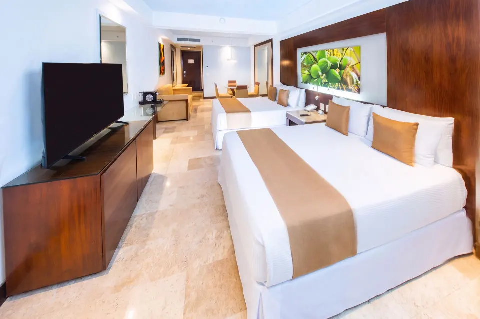 Altitude Club Junior Suite Swim Out with two beds and TV console at Krystal Grand Nuevo Vallarta.