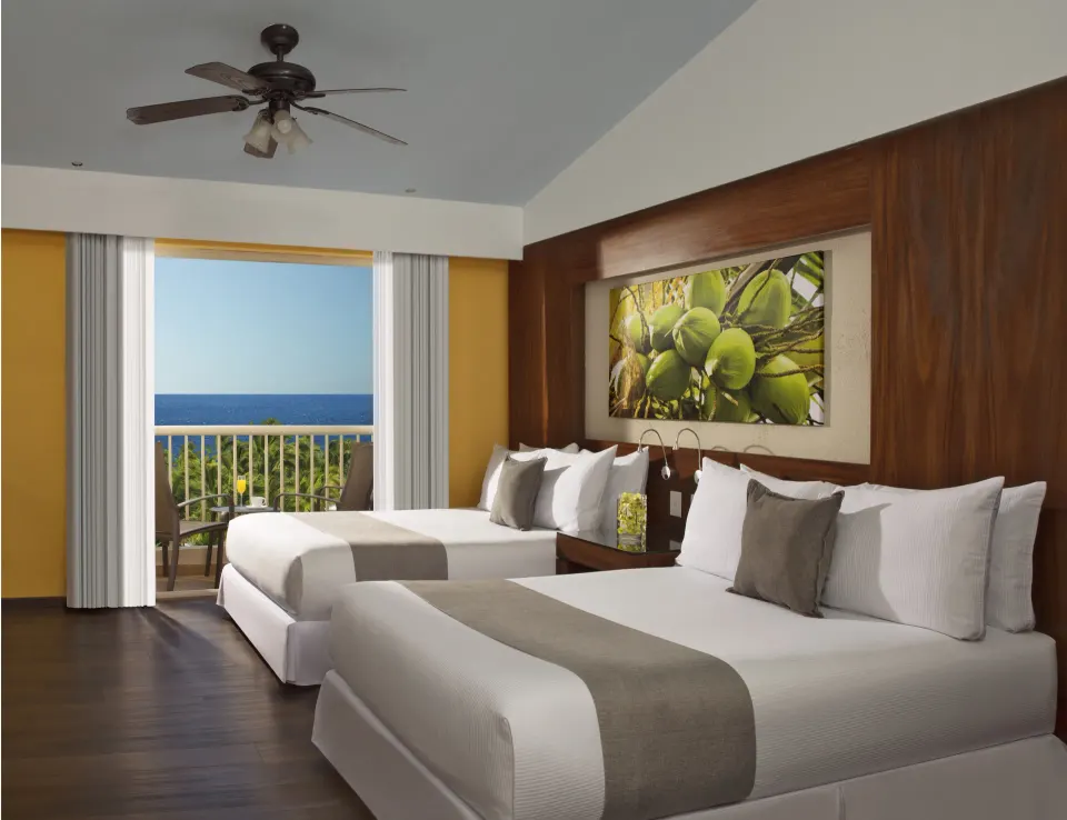 Deluxe Ocean View double room beds and balcony at Krystal Grand Nuevo Vallarta.