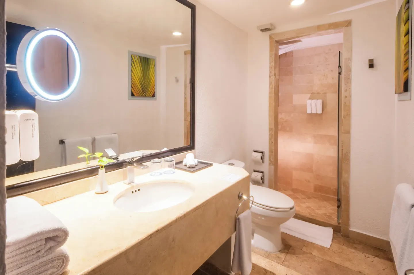 Deluxe Tropical Room View bathroom with vanity and shower at Krystal Grand Nuevo Vallarta.