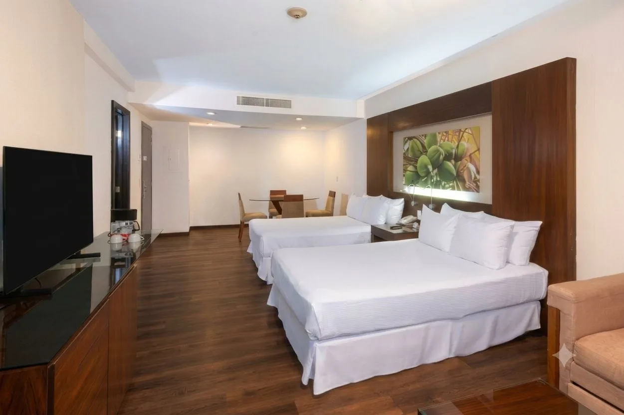 Deluxe Tropical Room View with two beds and TV console at Krystal Grand Nuevo Vallarta.