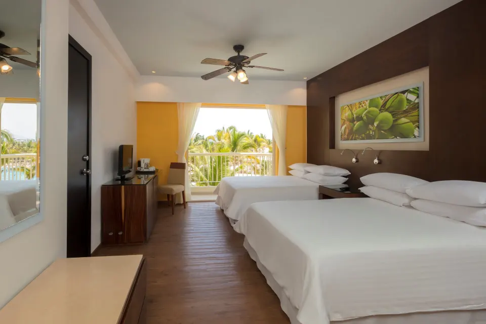 Deluxe Tropical View Doble room with balcony and two beds at Krystal Grand Nuevo Vallarta.