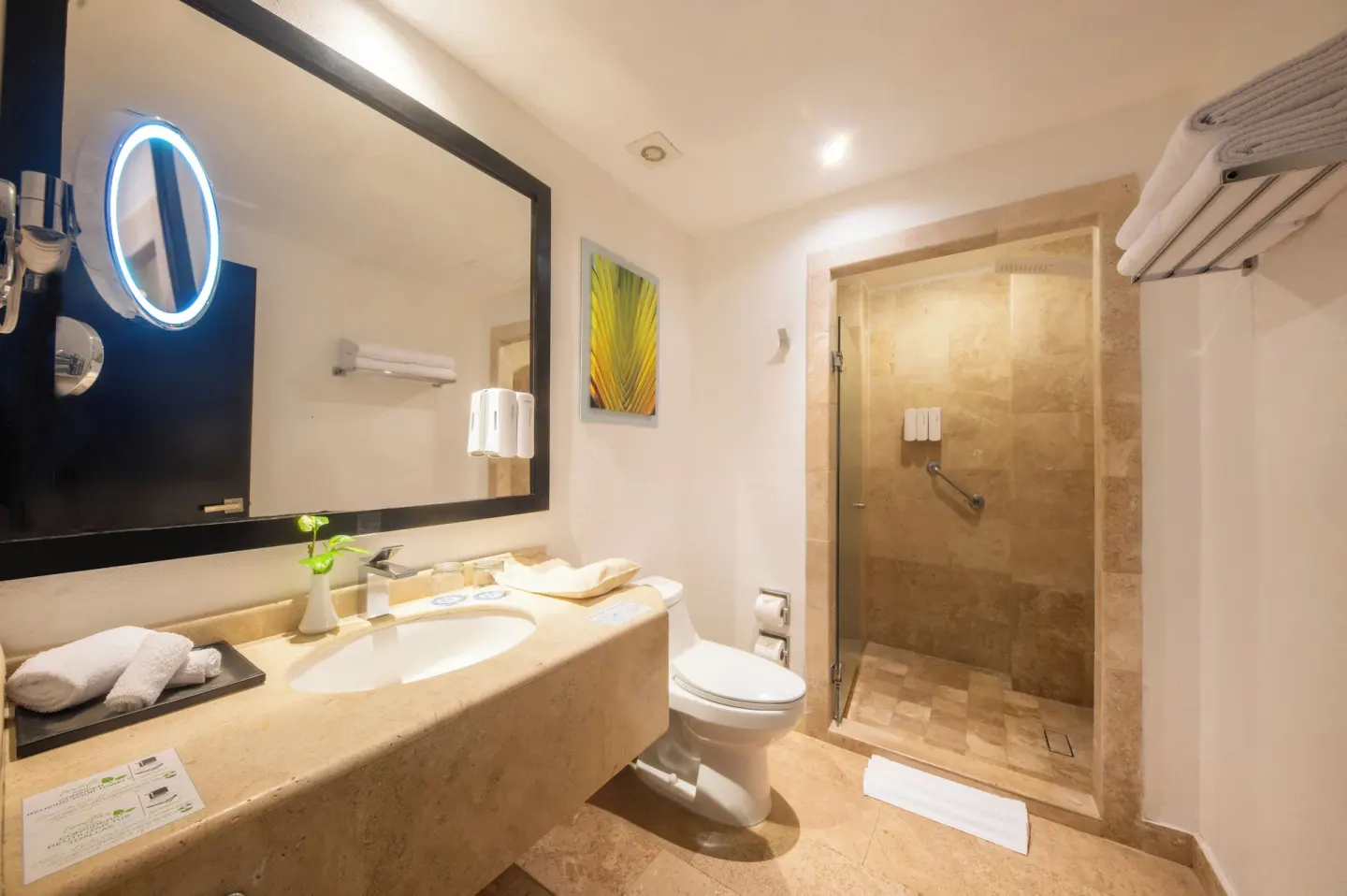 Family Kyds Room bathroom with vanity and glass shower at Krystal Grand Nuevo Vallarta