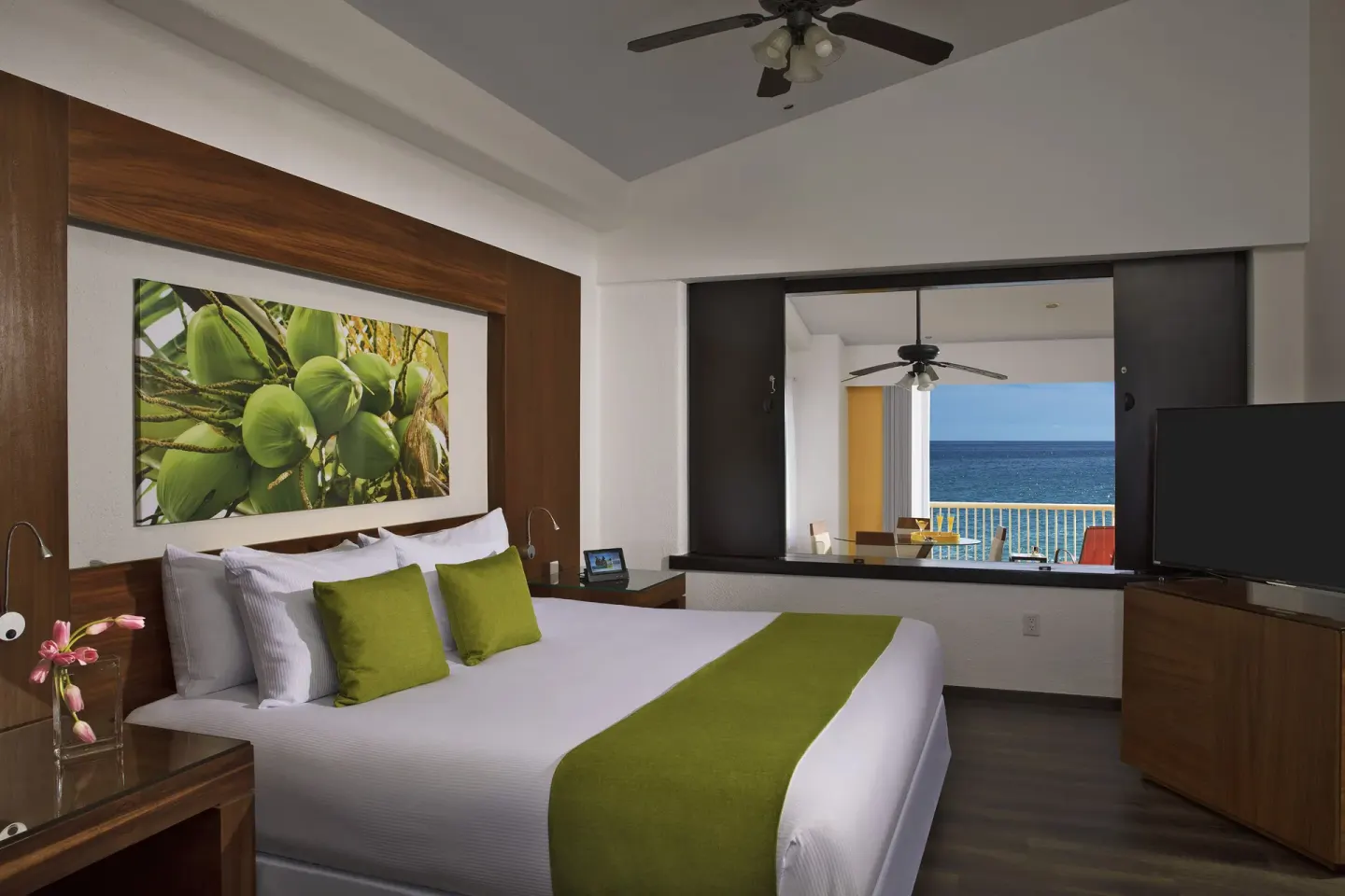 Junior Suite Ocean Front king bed and balcony view at Krystal Grand Nuevo Vallarta.