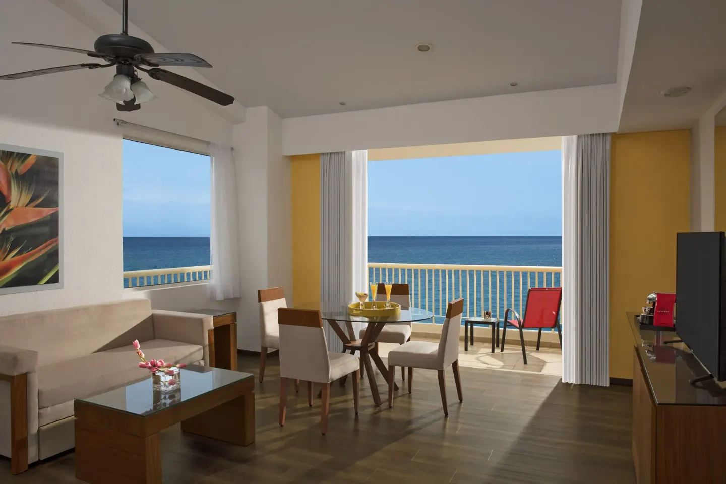 Junior Suite Ocean Front lounge and balcony facing the ocean at Krystal Grand Nuevo Vallarta.