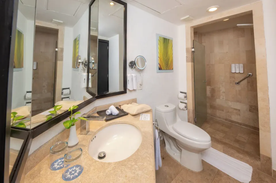 Junior Suite Ocean View bathroom with vanity and shower at Krystal Grand Nuevo Vallarta.
