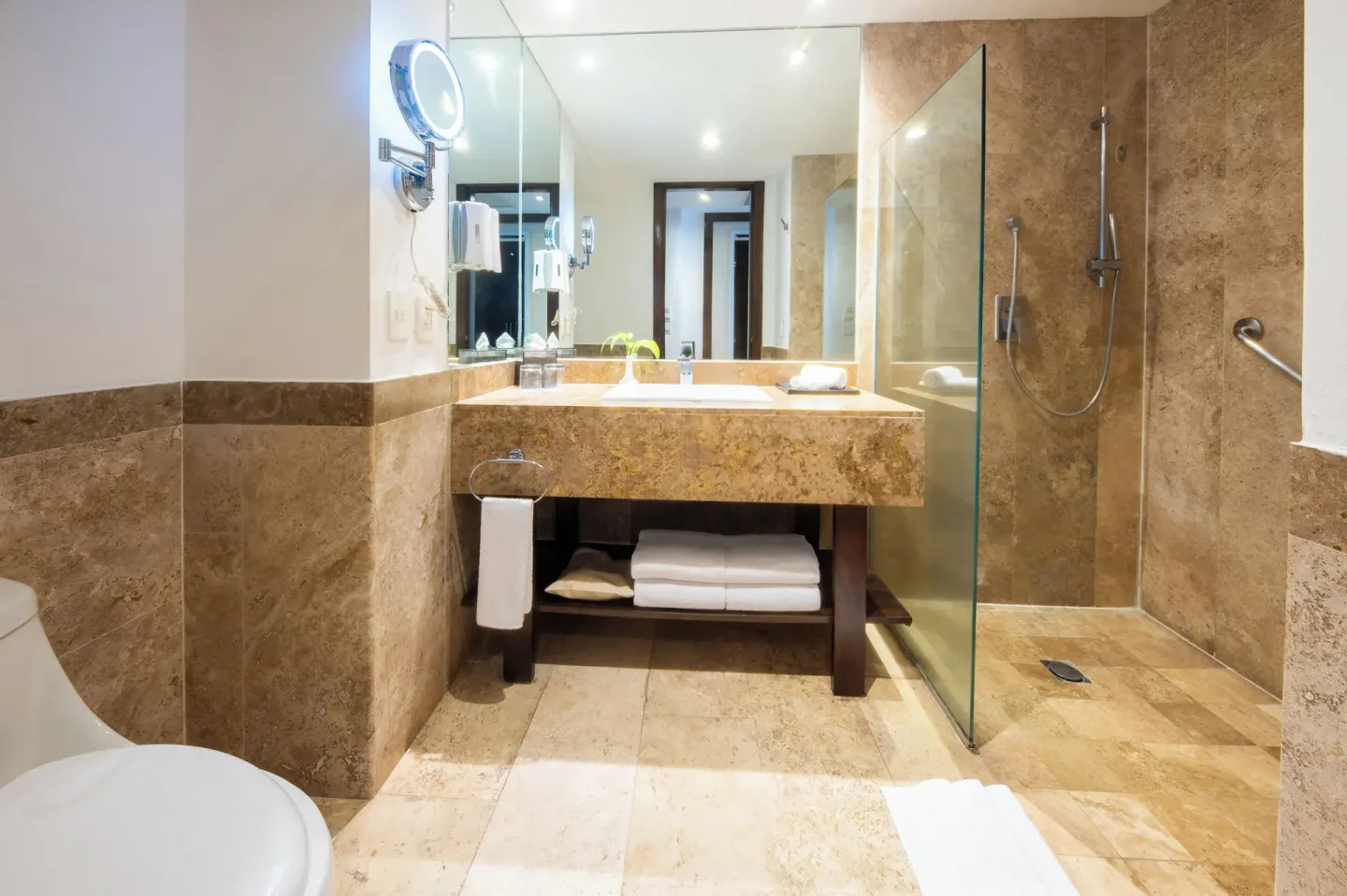 Junior Suite Pool View bathroom with vanity and glass shower at Krystal Grand Nuevo Vallarta.