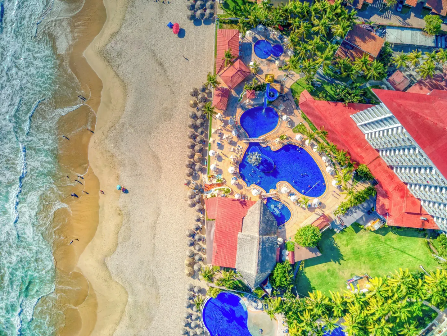 Aerial view of the beachfront pools and sandy shore at Krystal Ixtapa.