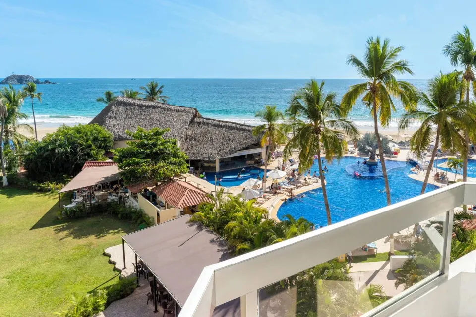 Sea view from a Standard Room balcony overlooking pool and beach at Krystal Ixtapa.