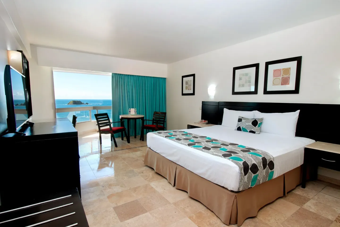 Superior Ocean View Room with king bed and balcony at Krystal Ixtapa.