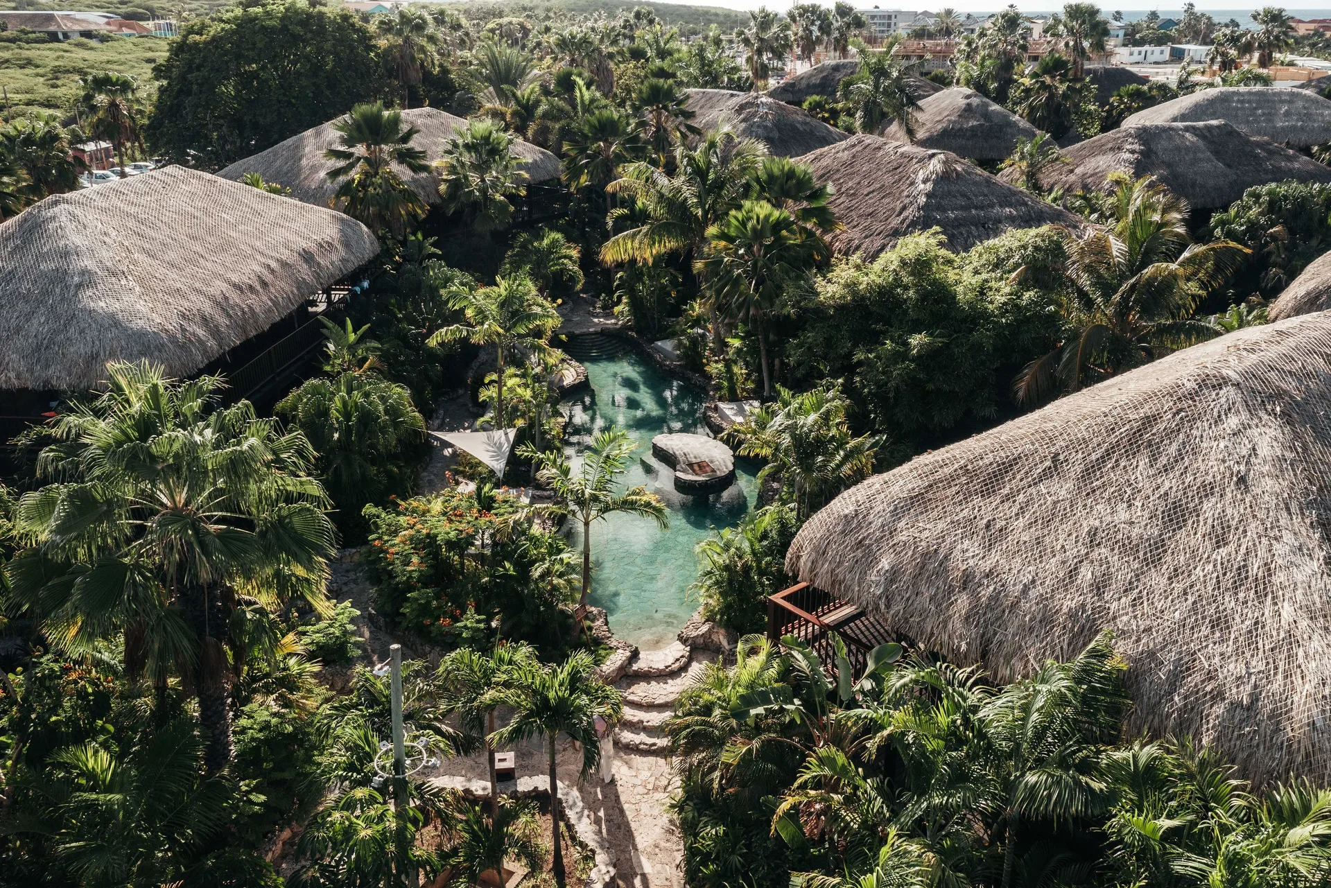 The Kontiki Curacao tropical beach resort with cabana-style rooms, lush pools, and Mambo Beach access