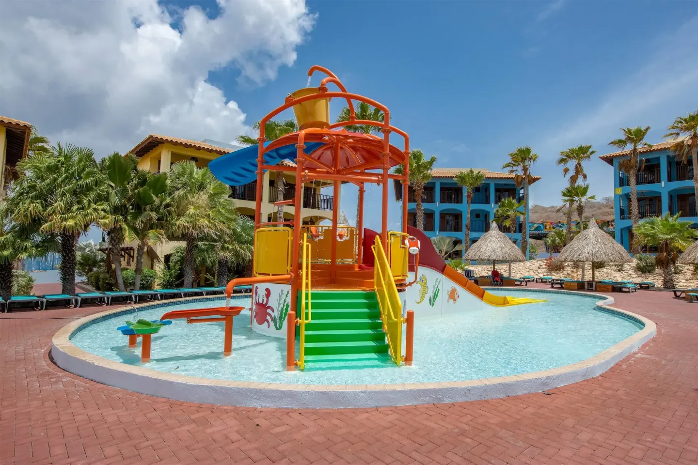 Children’s pool with orange water play tower at Kunuku Resort Curacao.