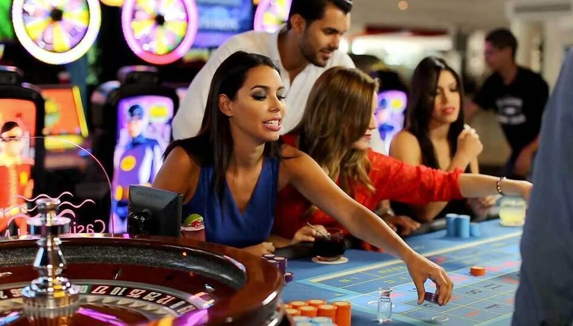 Guests play table games in a lively casino area at La Concha Resort, Puerto Rico.