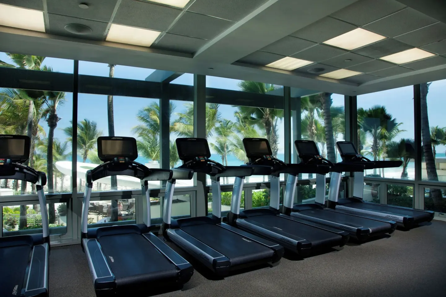Treadmills line the windows of the fitness center at La Concha Resort, Puerto Rico.