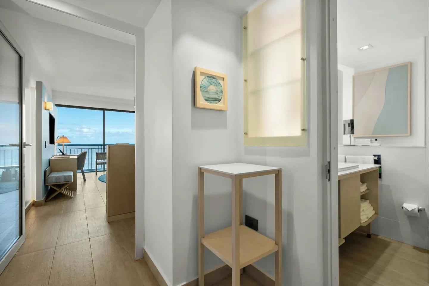 Guest room entry with bathroom and ocean-view room beyond at La Concha Resort, Puerto Rico.