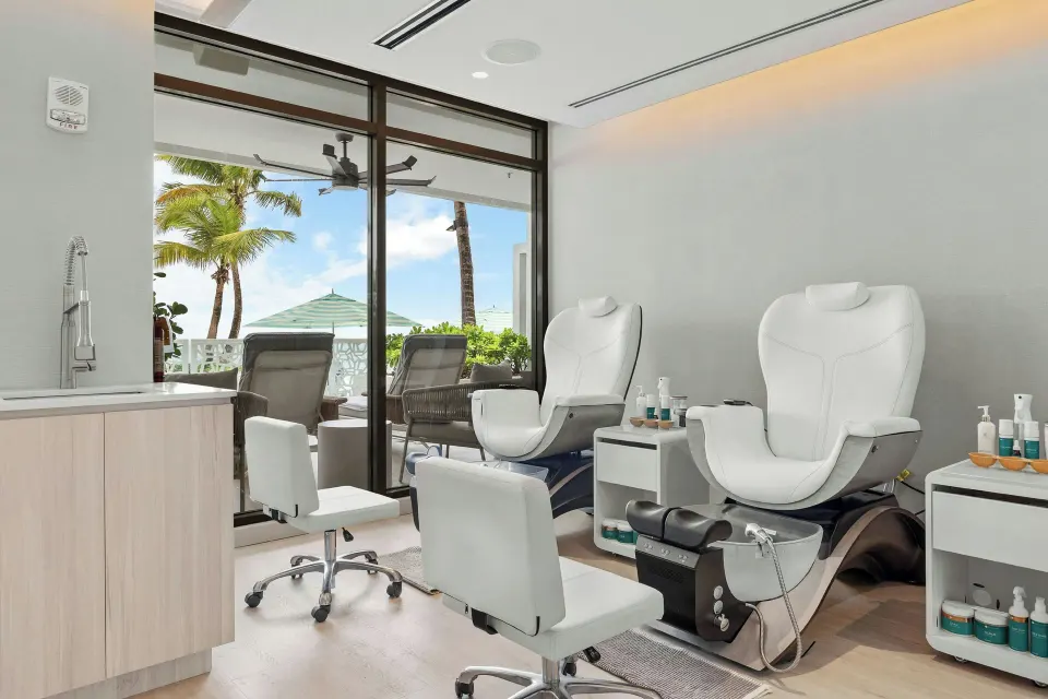 Pedicure chairs in a bright salon room with terrace views at La Concha Resort, Puerto Rico.