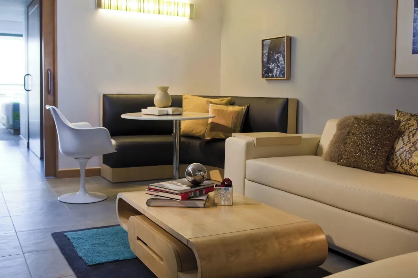 Suite sitting area with sofa, banquette, round table, and coffee table at La Concha Resort, Puerto Rico.