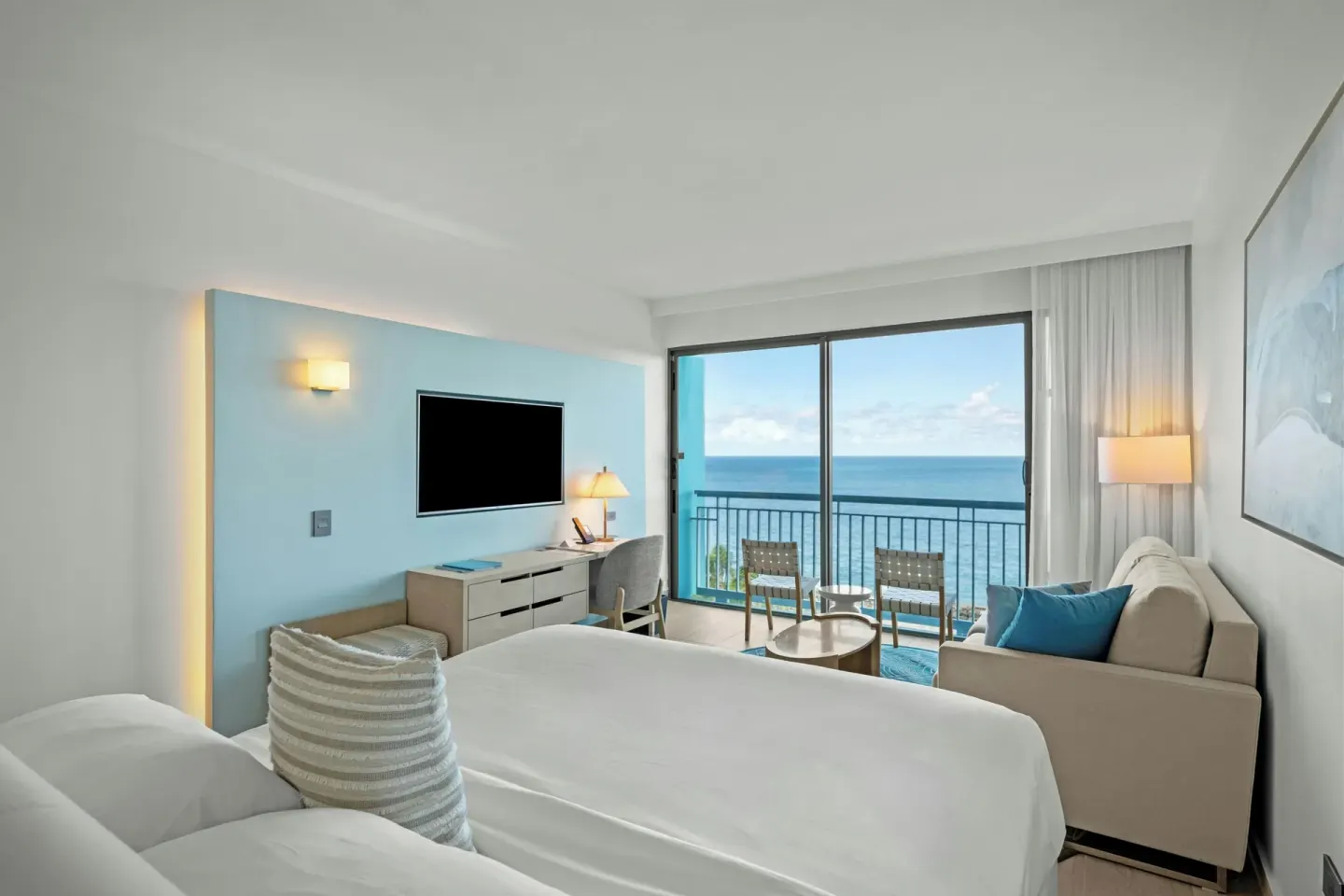 Deluxe Ocean View king room with balcony chairs and sofa at La Concha Resort, Puerto Rico.