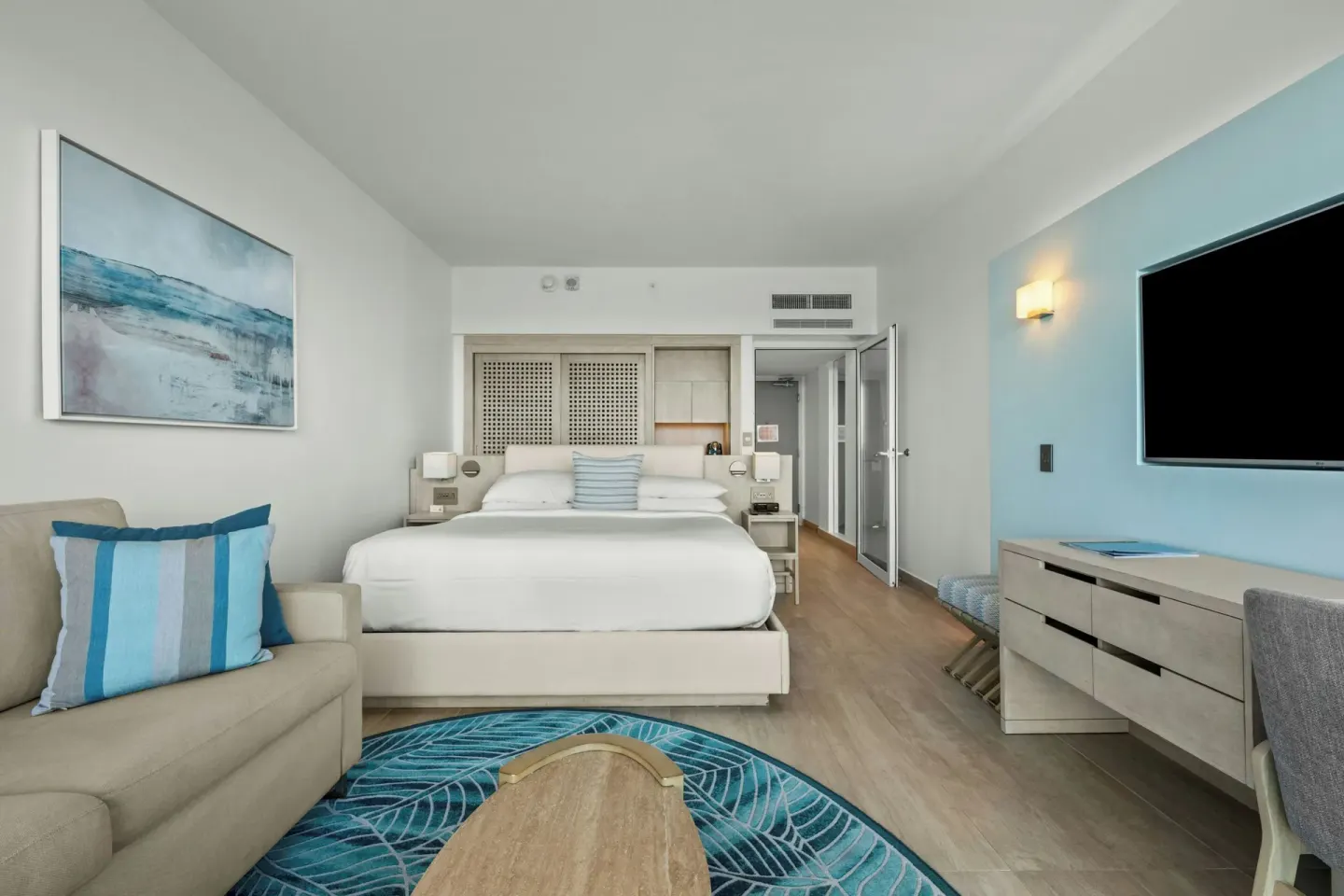 Deluxe Ocean View room with king bed, sofa and TV at La Concha Resort, Puerto Rico.
