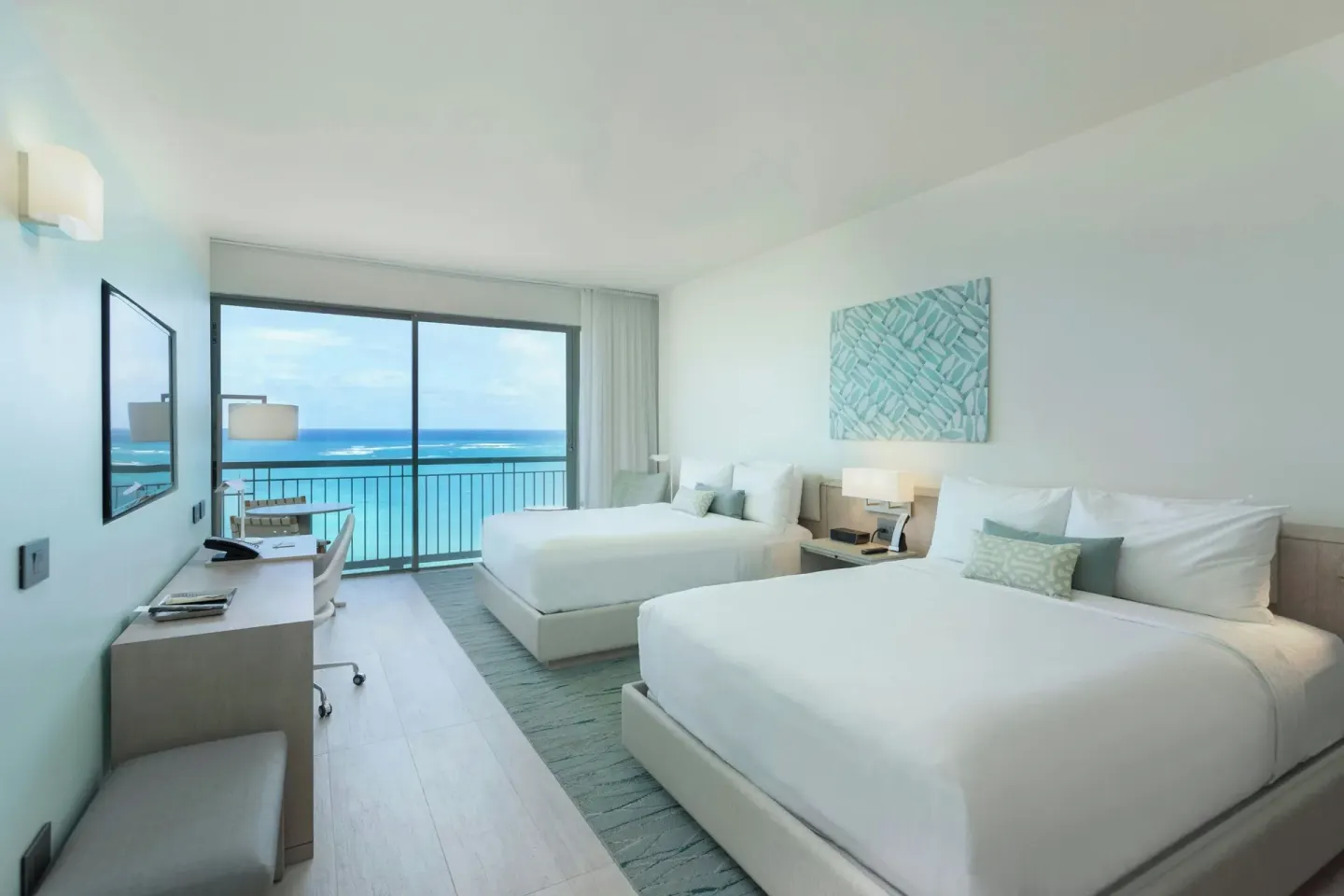 Two-bed Deluxe Ocean View room with desk and balcony doors at La Concha Resort, Puerto Rico.