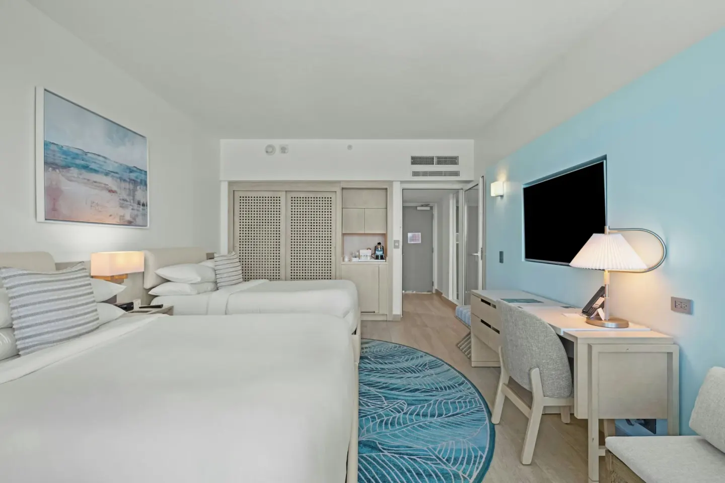 Deluxe Ocean View room with two beds, desk and TV at La Concha Resort, Puerto Rico.