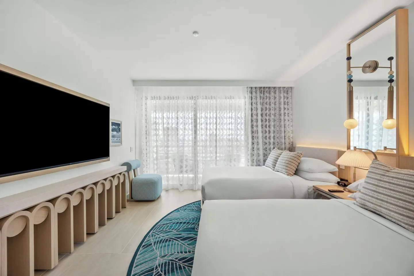 Deluxe Suite bedroom with two beds and TV at La Concha Resort, Puerto Rico.