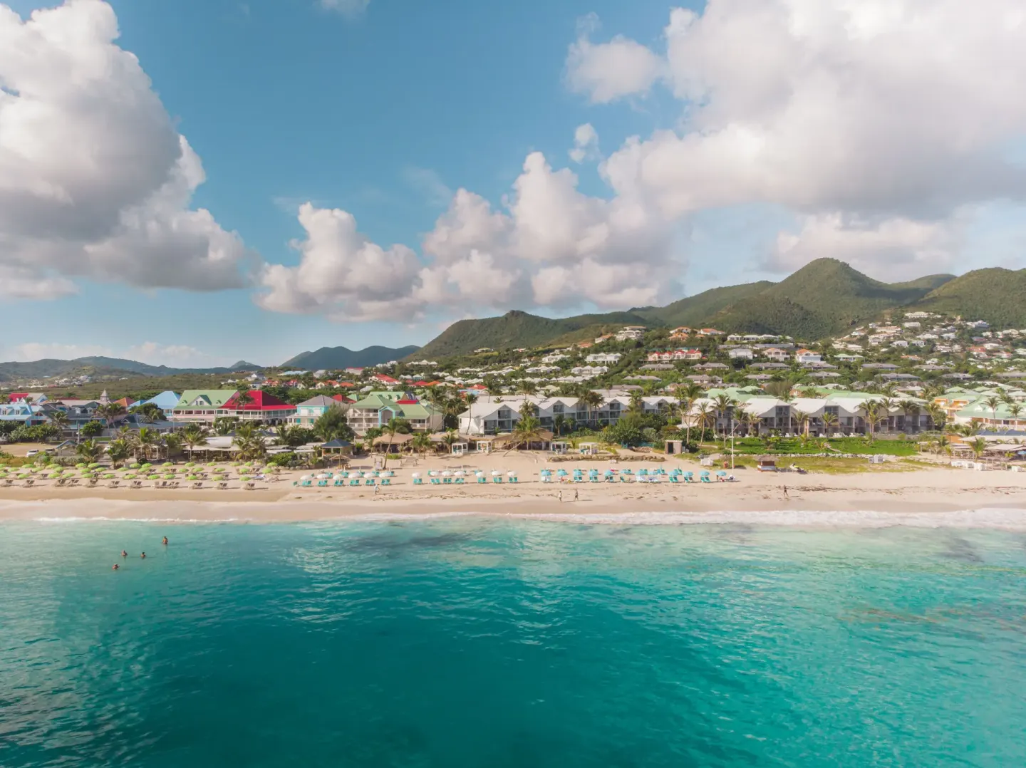 Aerial view of La Playa Orient Bay beach and hillside behind La Playa Orient Bay.